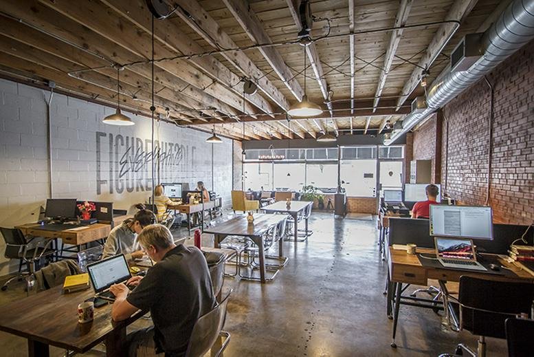 Spacious industrial coworking space at 2766 Duniven Circle, South Side, Amarillo, Texas with exposed wood ceilings.