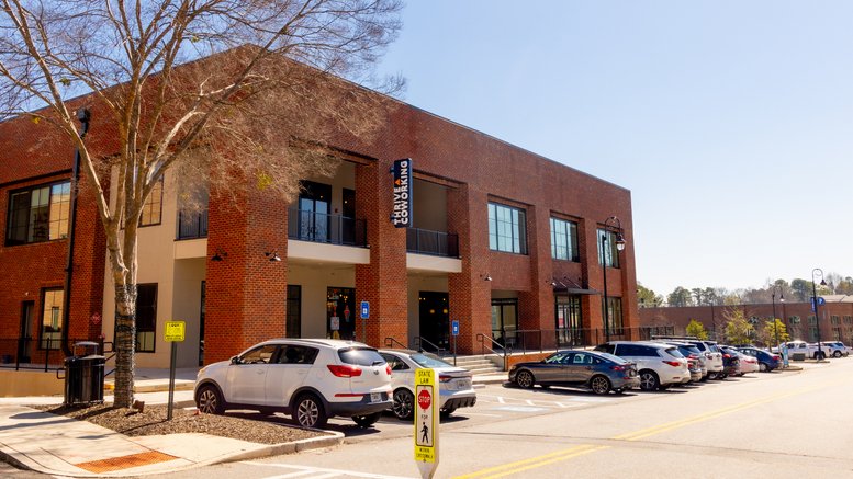 Exterior view of the brick facade at 3176 Main Street, Duluth (Georgia) with parking in front.