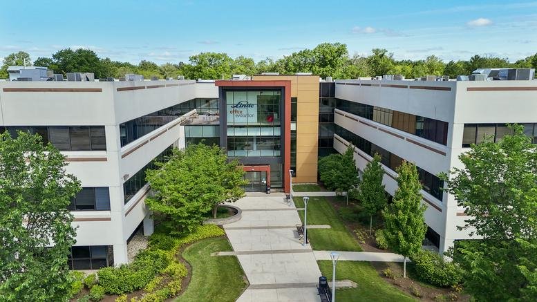 Exterior view of the white facade and glass entrance of 325 Sentry Parkway East, Suite 301, Blue Bell.