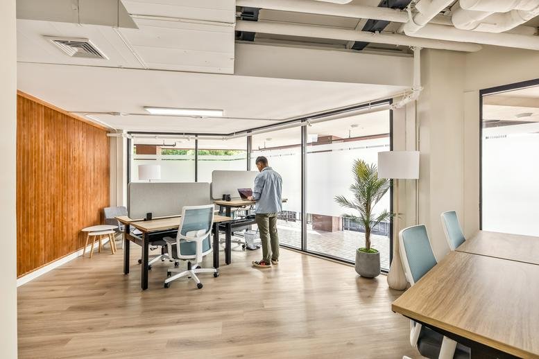 Spacious sunlit open-plan office at 438 Hobron Ln, PH 1, Honolulu with floor-to-ceiling windows.