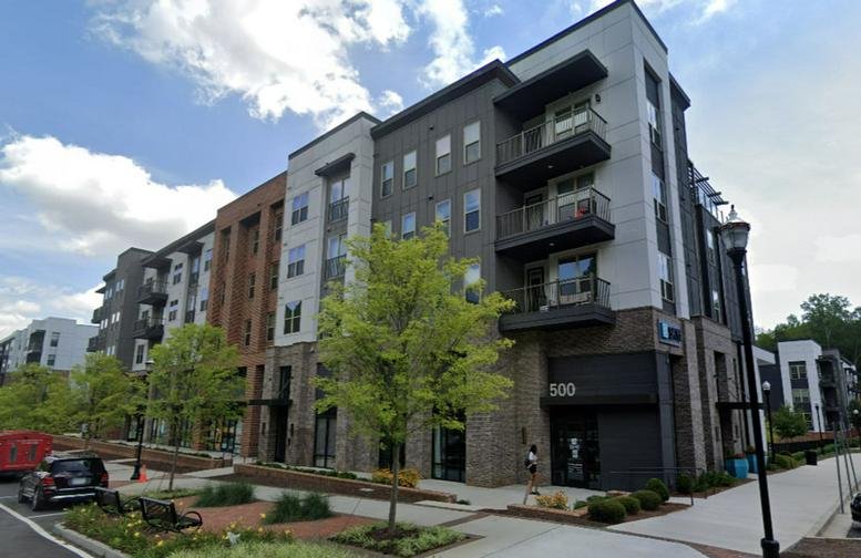 Exterior view of the multi-story modern building at 500 Buford Highway, Suwanee, Georgia.