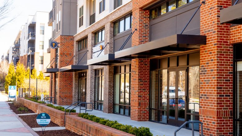 Exterior view of the brick and glass facade at 500 Buford Highway, Suwanee, Georgia.
