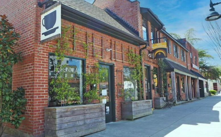 Exterior brick facade and street-level entrance of 505 W Franklin Street, Chapel Hill, North Carolina.