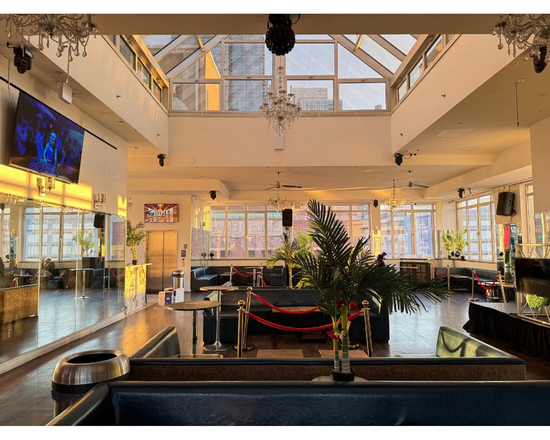 Large open-plan lounge at 617, West 46th Street, PH Floor with high ceilings and skylights.