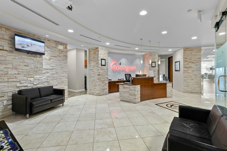 Spacious reception lobby at 6751 North Sunset Boulevard, No. 320, Glendale (Arizona) with stone accent walls.