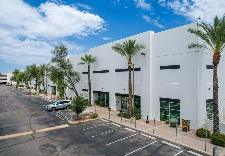 Exterior view of the white industrial facade at 910 West Carver Road, Tempe, Arizona.