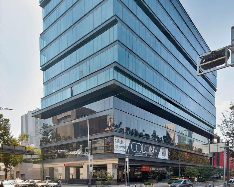 Exterior view of the glass-facade Avenida Chapultepec 360 building in Roma Norte.