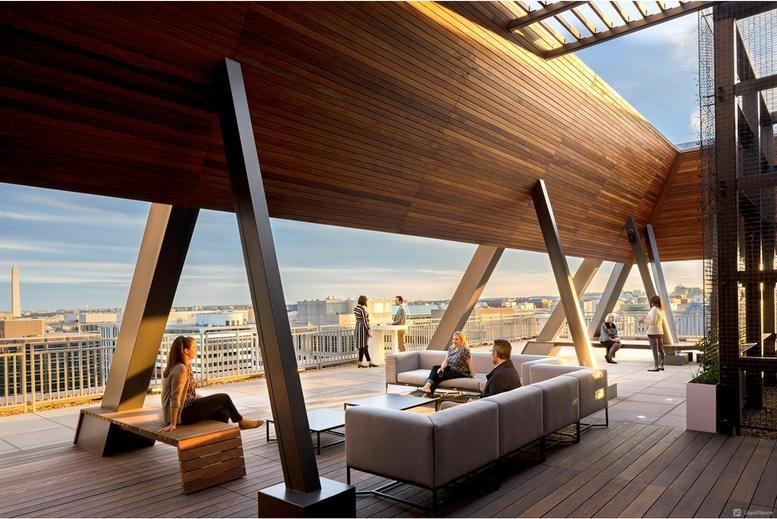 Rooftop terrace at Mindspace K Street, One Franklin Square with wooden architecture and city views.