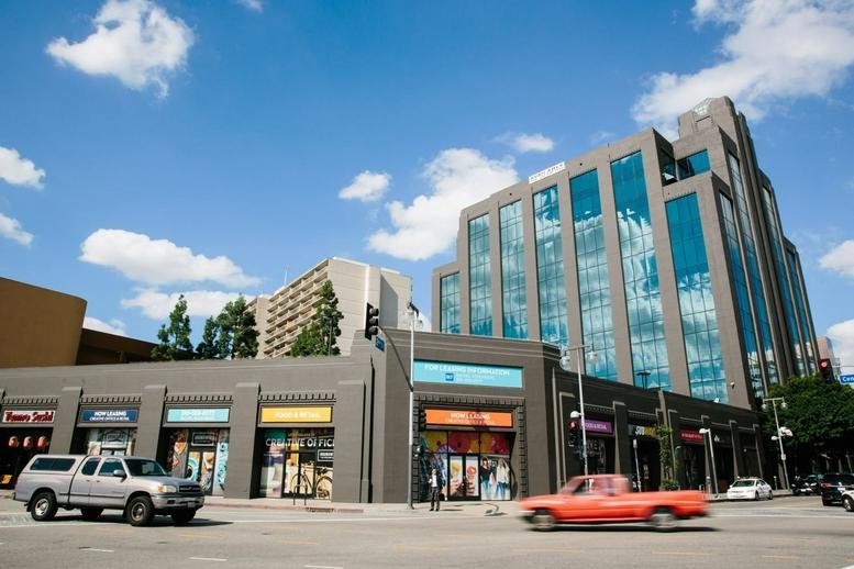 Exterior view of the multi-story glass and stone building at 360 East 2nd Street.