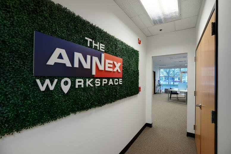 Entrance hallway at The Annex Workspace, Trade Center Boulevard, Chesterfield with a green moss feature wall.