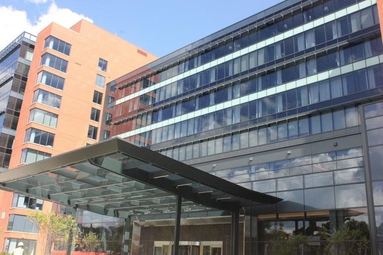 Exterior view of the modern glass and brick building at 7761 Diamondback Drive, College Park (MD).