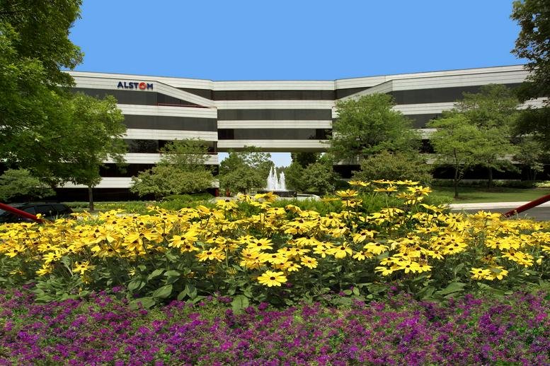 Exterior view of the landscaped corporate building at 650 Warrenville Road.