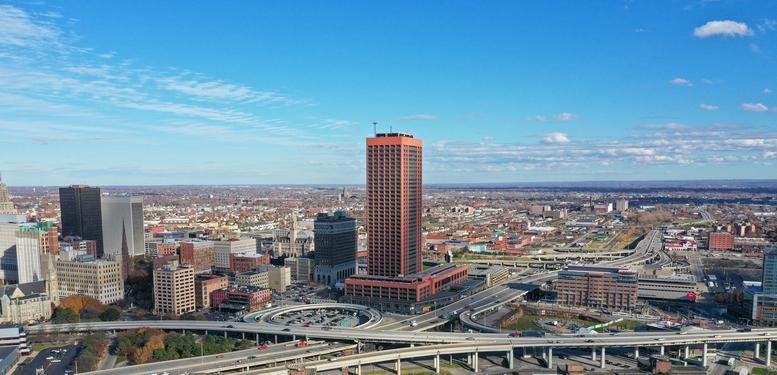 Exterior aerial view of the red-toned skyscraper at 1 Seneca Street.