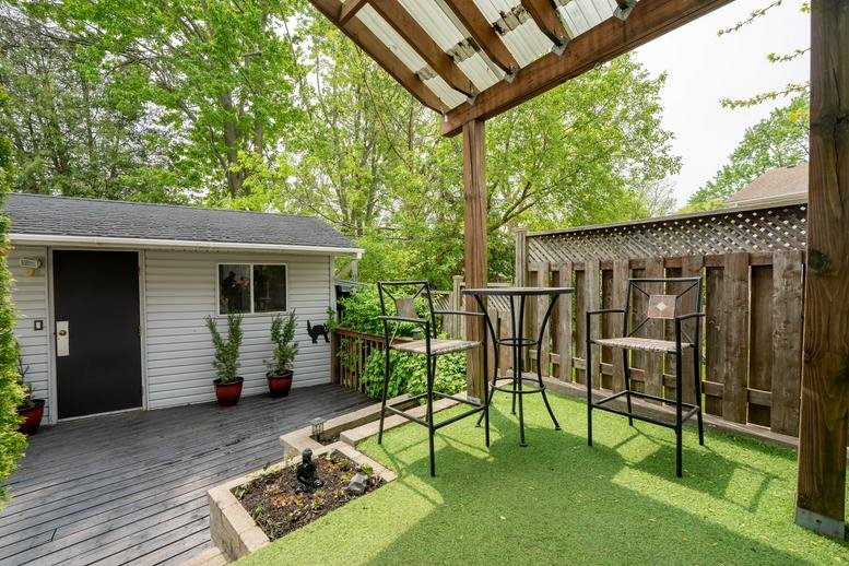 Exterior view of the standalone studio building at 10 Lisa Court, London (Ontario) with a patio area.