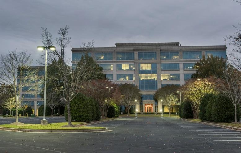 Exterior view of the multi-story glass building at 100 North Point Center East, Suite 125 & 200.