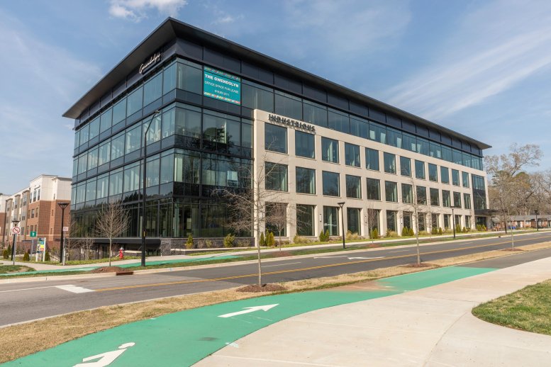 Exterior view of the contemporary glass and stone building at 101 Glen Lennox.