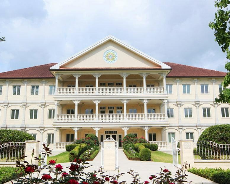Exterior view of the main building at 10210 Grogans Mill Road.