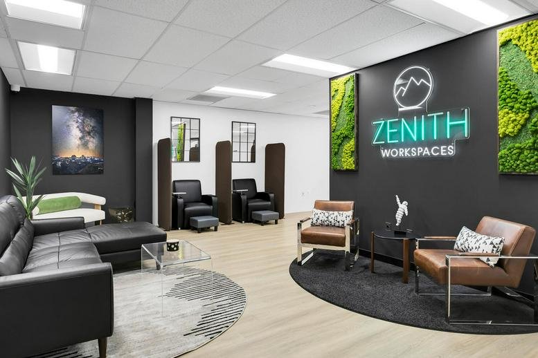 Spacious reception area at 106 Apple Street, 200W, Tinton Falls with lounge seating and green moss wall features.