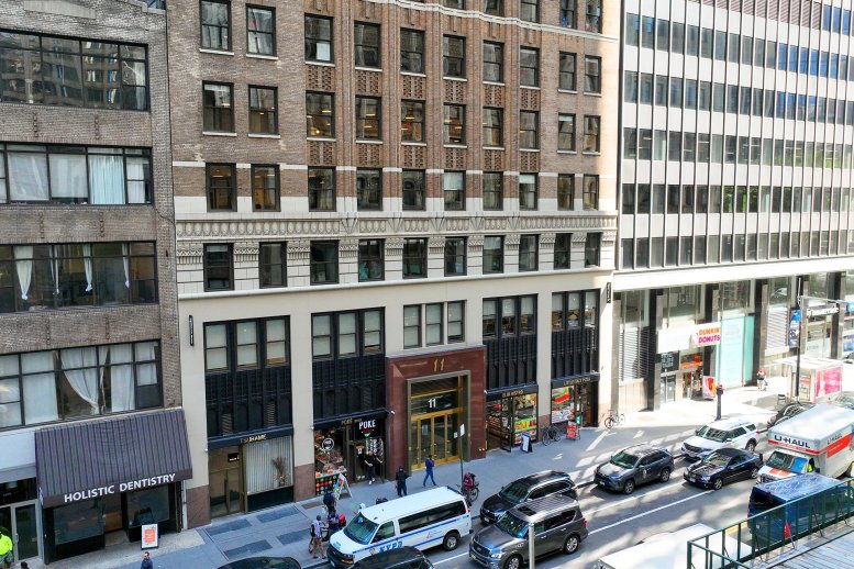 Exterior view of the classic stone and brick facade of 11 Park Place in New York City.