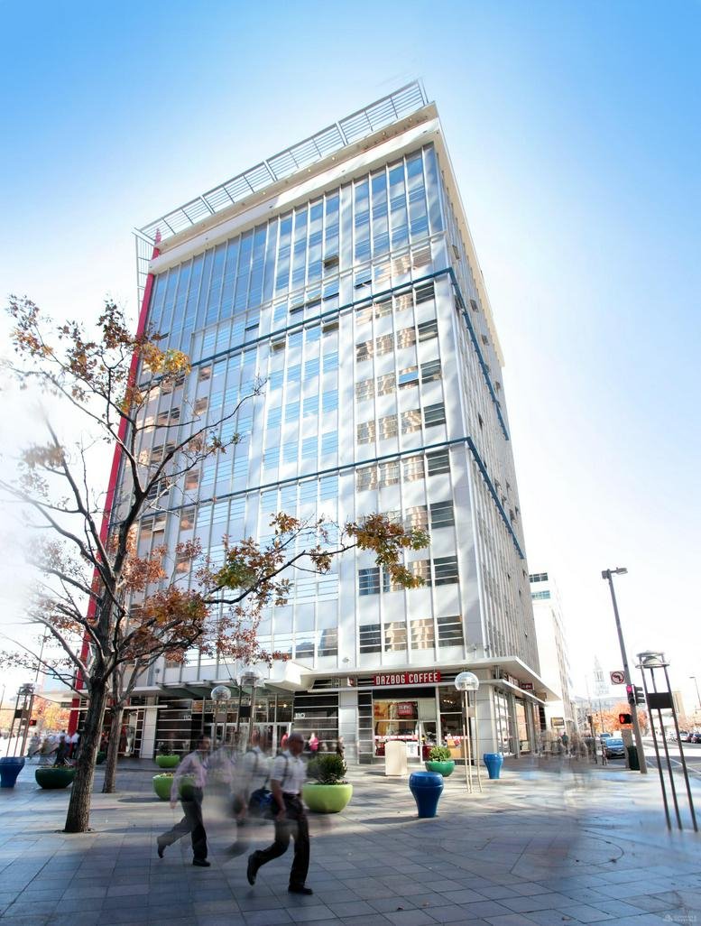 Exterior view of the high-rise glass and concrete building at 110 16th Street Mall.