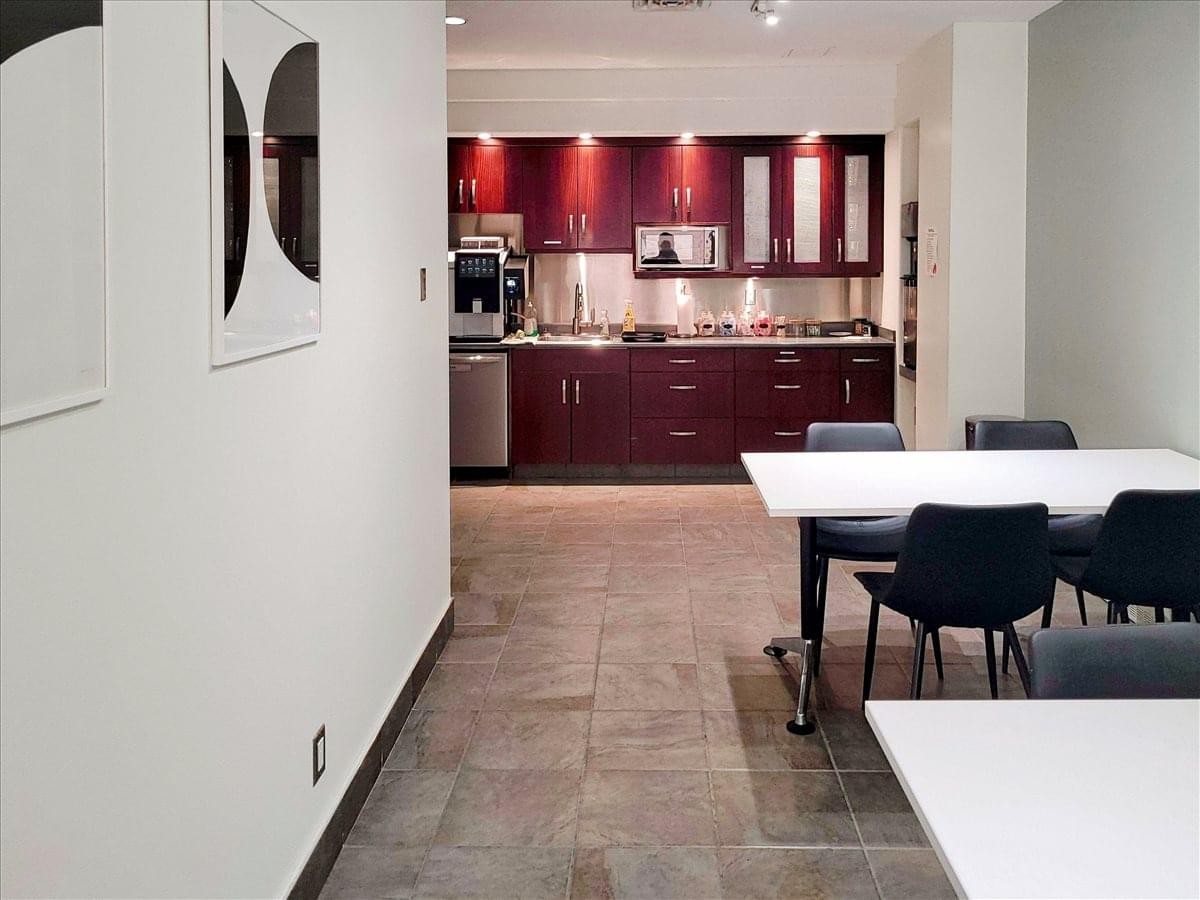 Spacious communal kitchen and dining area at 111 2nd Street Avenue, Saskatoon.