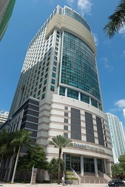 Exterior view of the towering glass-facade Sabadell Financial Center at 1111 Brickell Avenue.