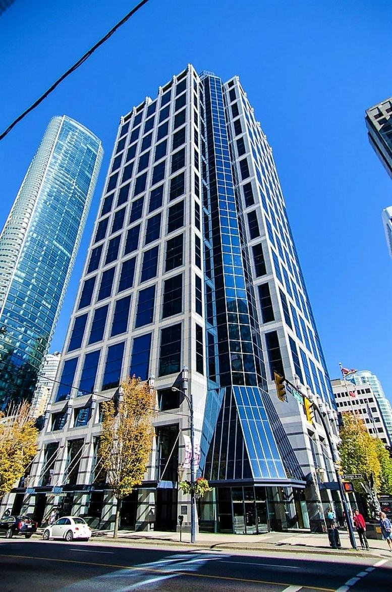 Exterior view of the striking glass and stone facade at 1111 West Georgia Street.