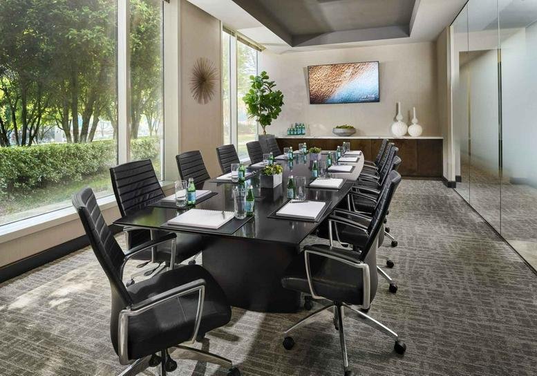 Professional conference room at 11175 Cicero Drive, Building 200, Suite 100, Alpharetta (Georgia) with floor-to-ceiling windows.