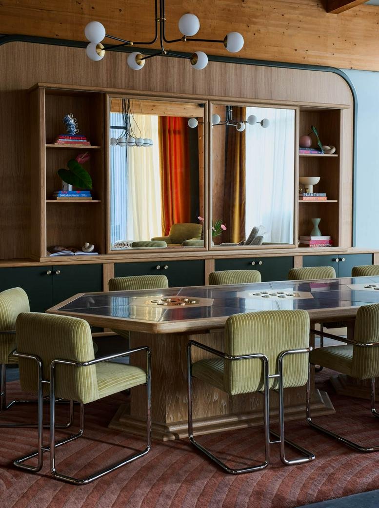Sophisticated boardroom with a large stone table and velvet chairs at 1131, 4th Avenue South, South Nashville.