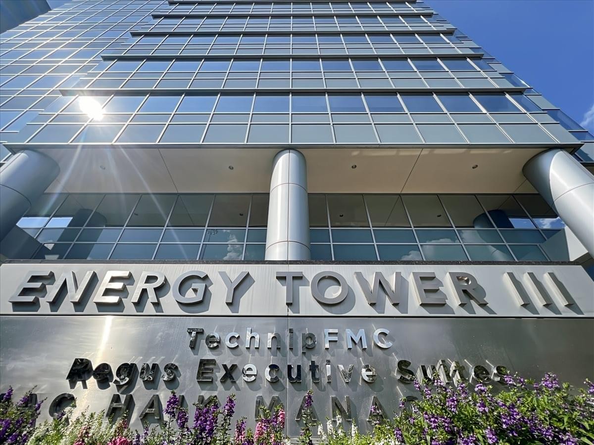 Ground level exterior view of the glass facade at Energy Tower III.