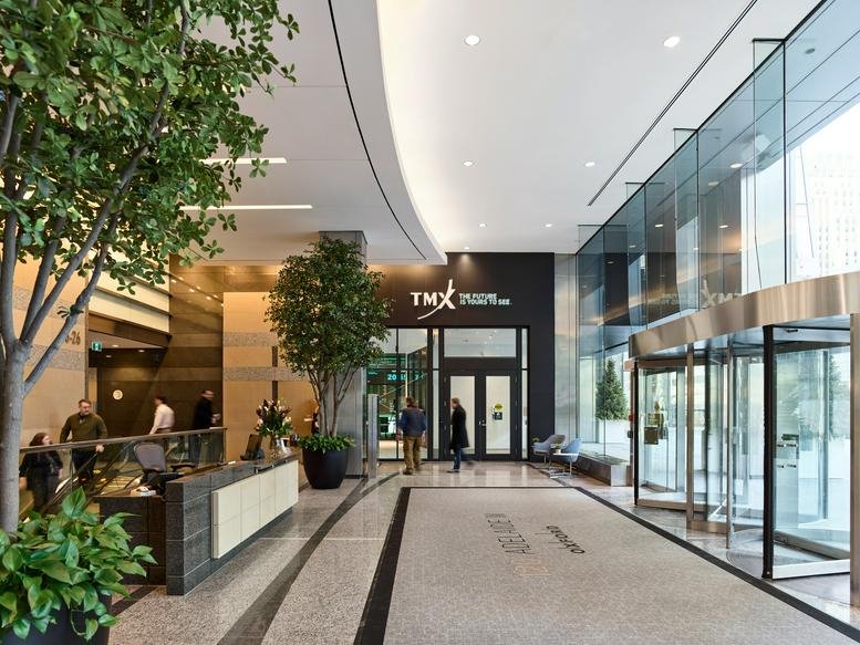 Reception area at 120 Adelaide Street West, Suite 2500 featuring wooden paneling and indoor trees.