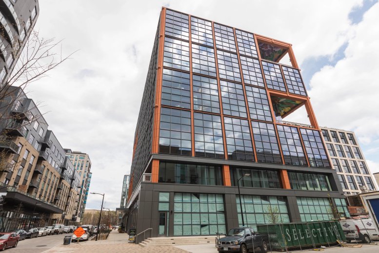 Exterior view of the modern glass and steel building at 1255 Union Street. NE, 7th Floor.