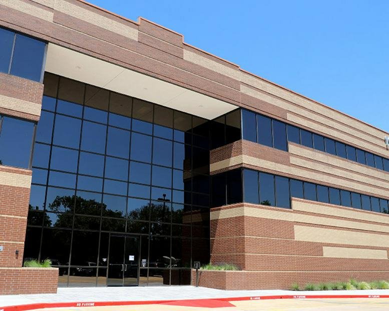 Exterior view of the brick and glass-facade building at 12808 West Airport Boulevard.