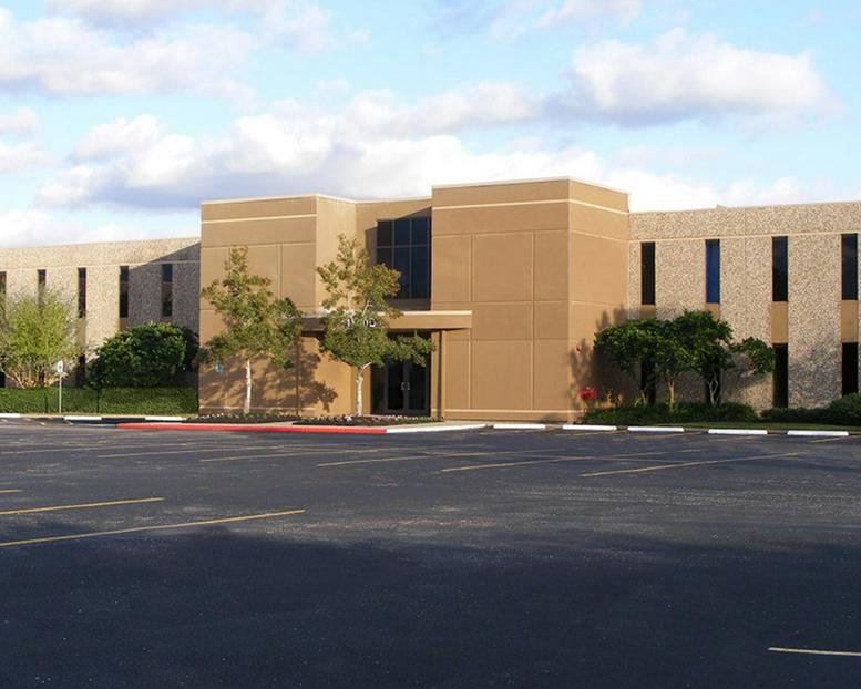 Exterior view of the tan brick building at 1300 Bay Area Boulevard, Clear Lake.