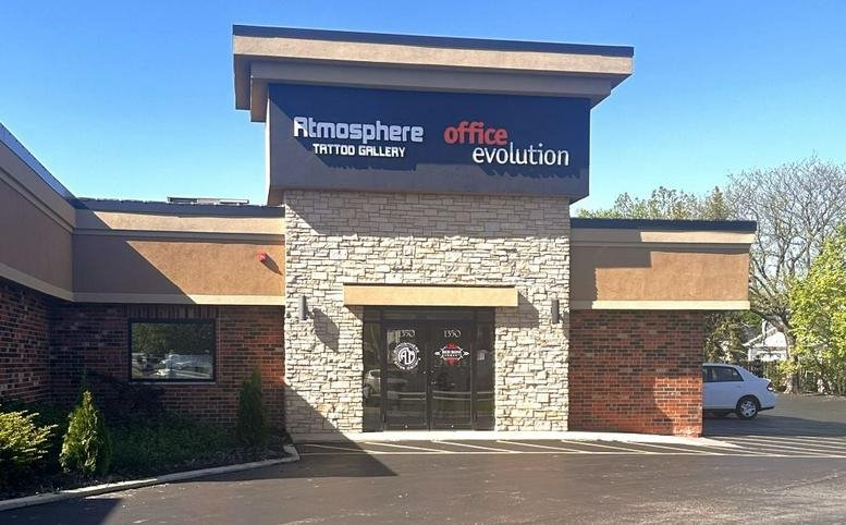 Exterior entrance of 1350 Lake Street, Suite K, Roselle, Illinois with stone facade and signage.