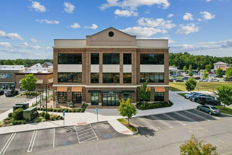 Exterior view of the brick office building at 14301 Winter Breeze Drive, Richmond (Virginia).