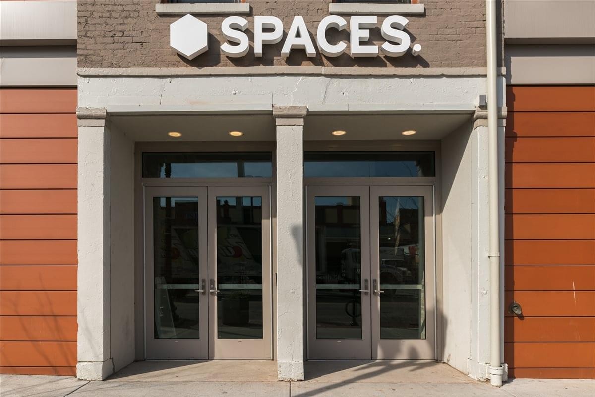 Exterior entrance of the brick building at 1435 Vine Street featuring double glass doors.