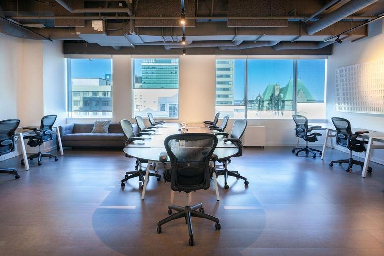 Spacious boardroom at 150 Elgin Street featuring a large oval table and expansive city views.