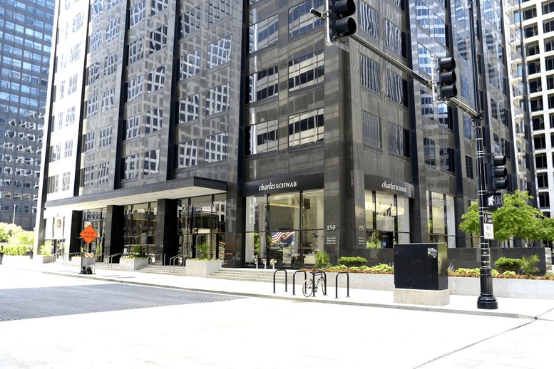 Exterior view of the dark glass facade and street entrance at 150 South Wacker.