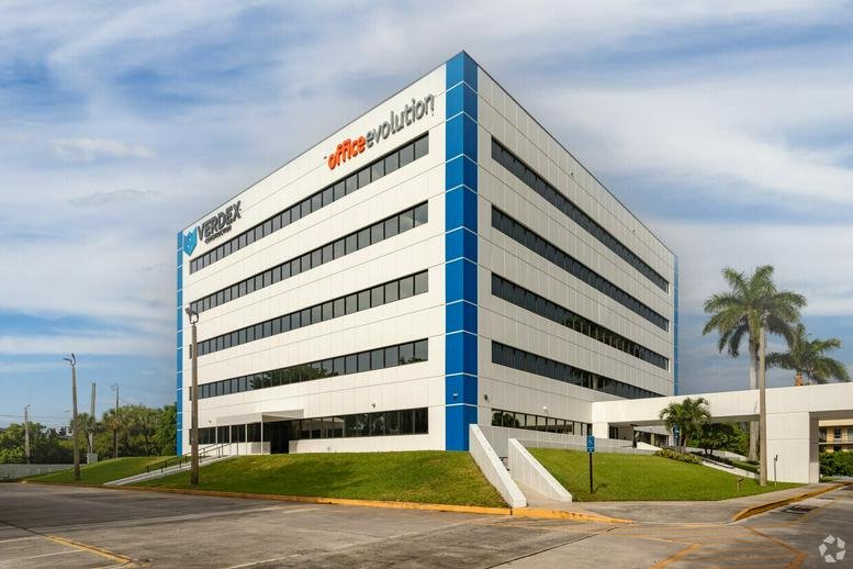 Exterior view of the multi-story office building at 1501 Belvedere Road, Suite 500.