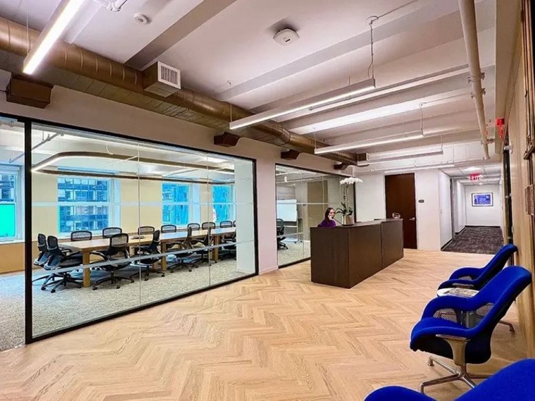 Spacious reception area and glass-walled conference room at 1501 Broadway, 12th Floor.