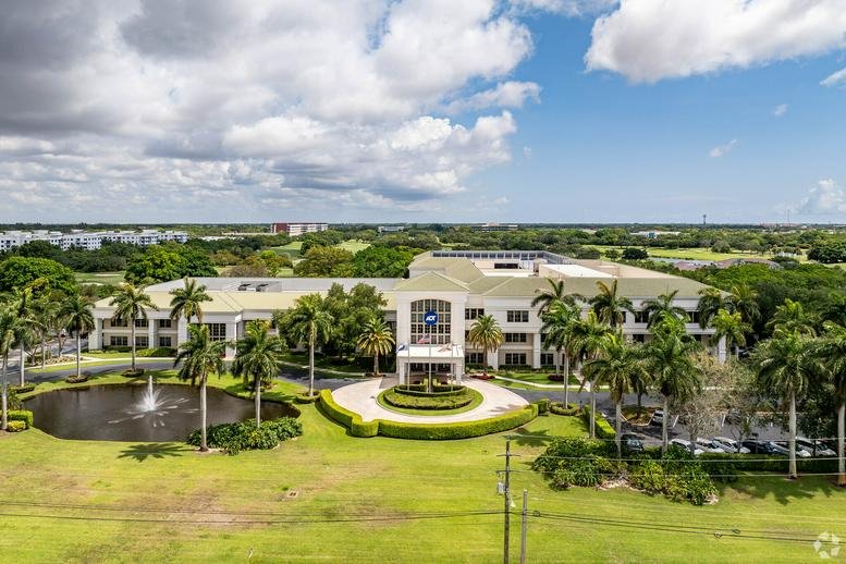 Aerial exterior view of the multi-story professional building at 1501 Yamato Road.