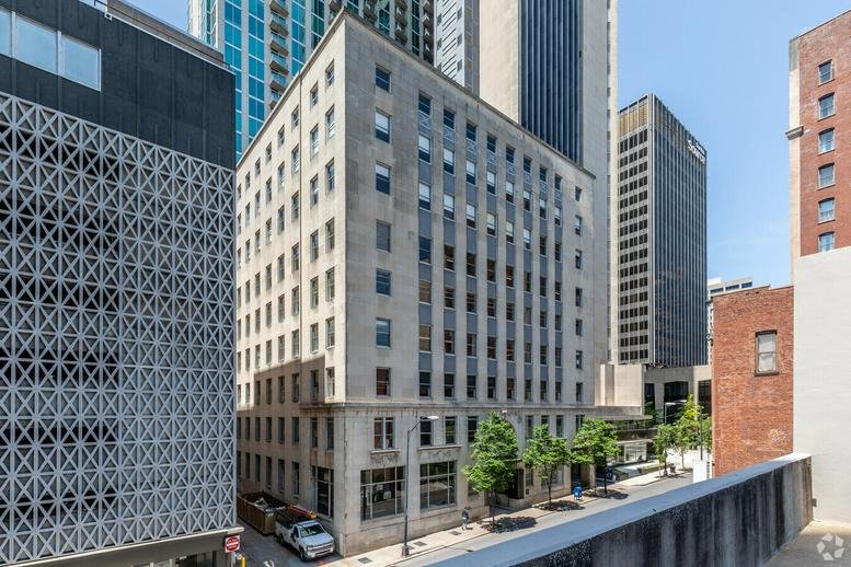 Exterior view of the historic stone building at 159 4th Ave N, Suite 100, Nashville.