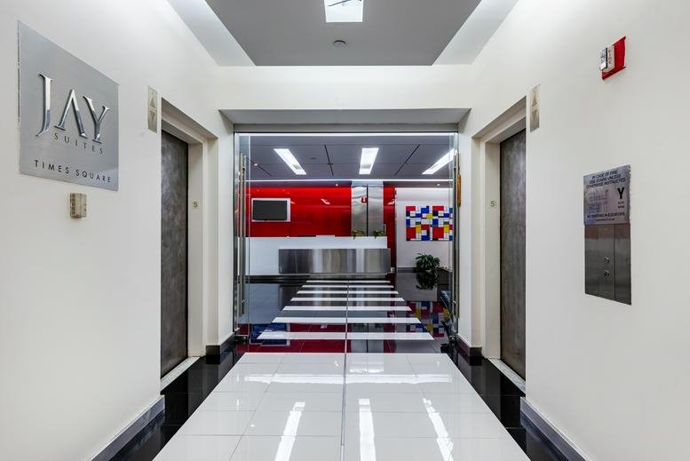 Modern building entrance with polished white floors and bright lighting at 159 West 25th Street.