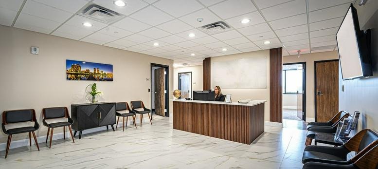 Modern lobby and front desk at 1601 Belvedere Road, East-300.