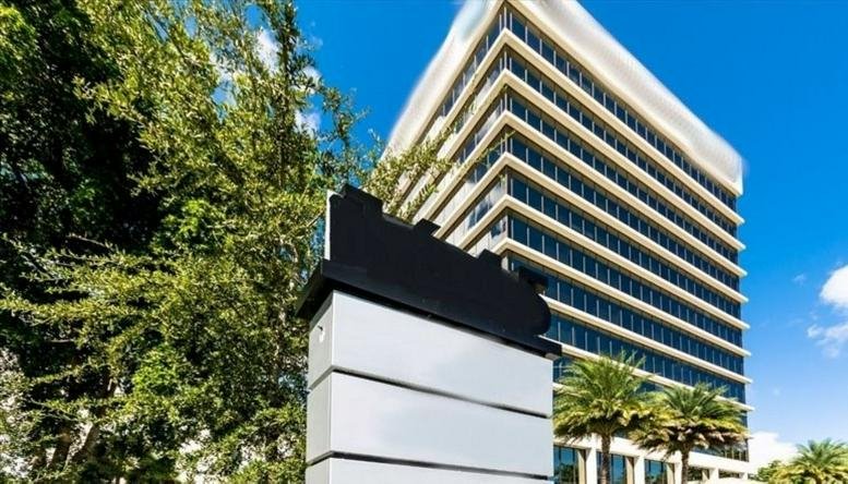 Exterior view of the glass-facade office building at 1645 Palm Beach Lakes Boulevard.