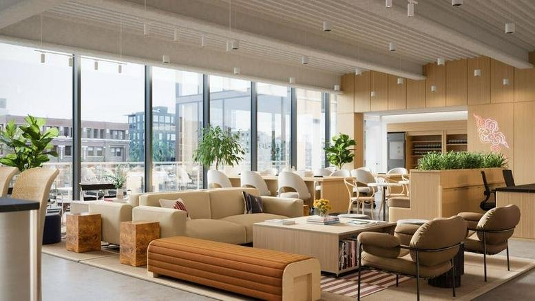 Spacious sun-drenched lounge at 167 North Green Street with wood accents and plush seating.