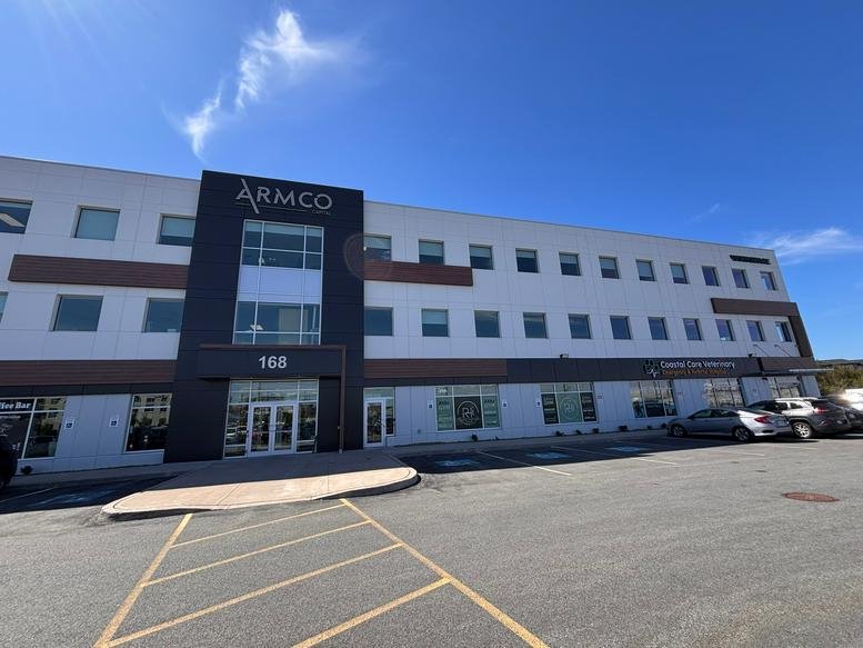 Exterior view of the white and black office building at 168 Hobsons Lake Drive, Suite 301.