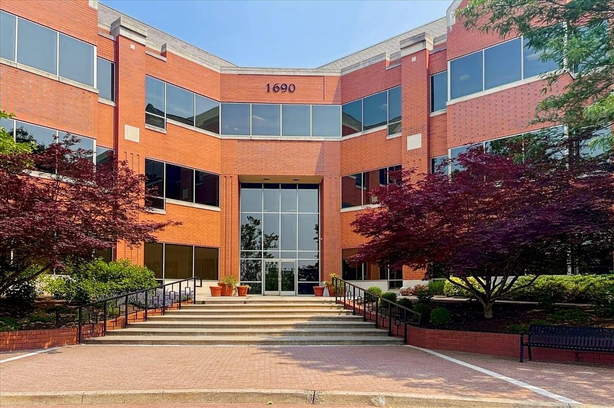Exterior of the red brick professional building at 1690 Sumneytown Pike with landscaped entrance.