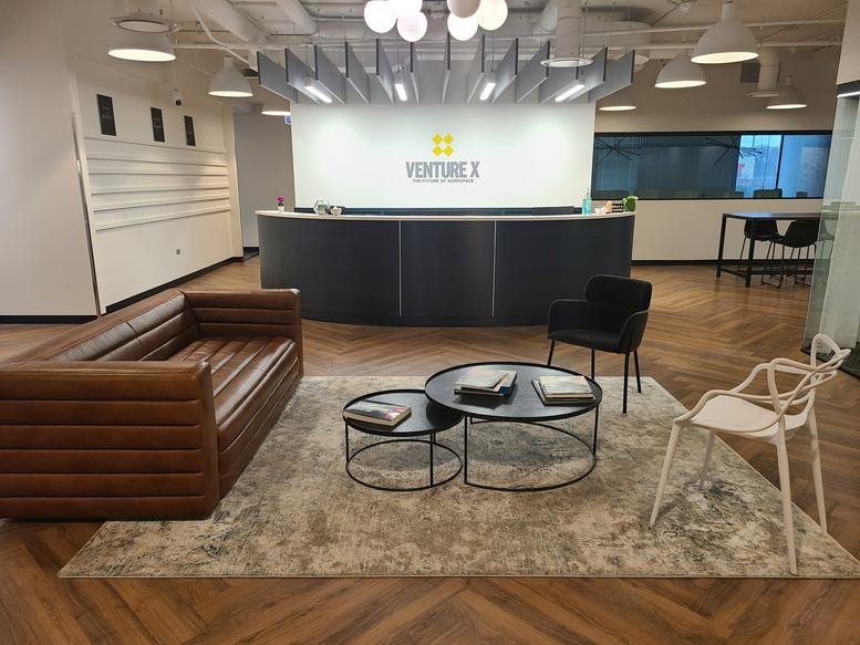 Main reception at 1701 Golf Rd, Tower 3, Floor 3, Rolling Meadows with a curved dark desk.